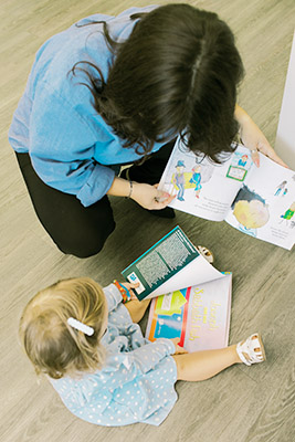 Chiropractic Jacksonville FL Assistant Reading to Child